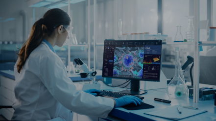 Scientist analyzing data on screen